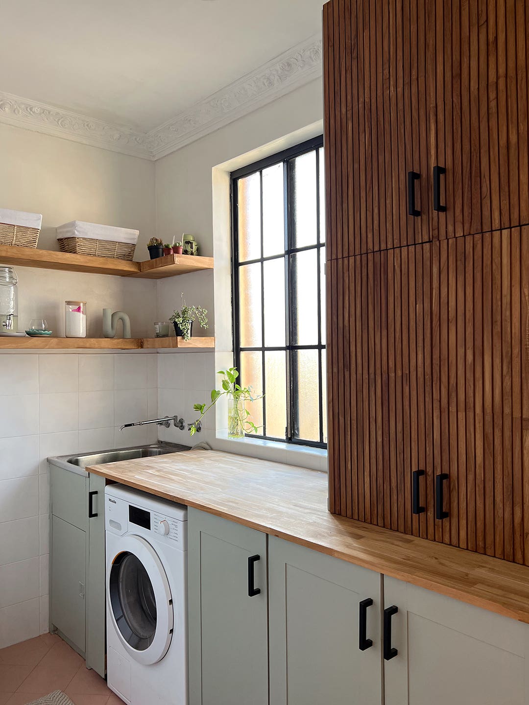 green laundry room cabinets