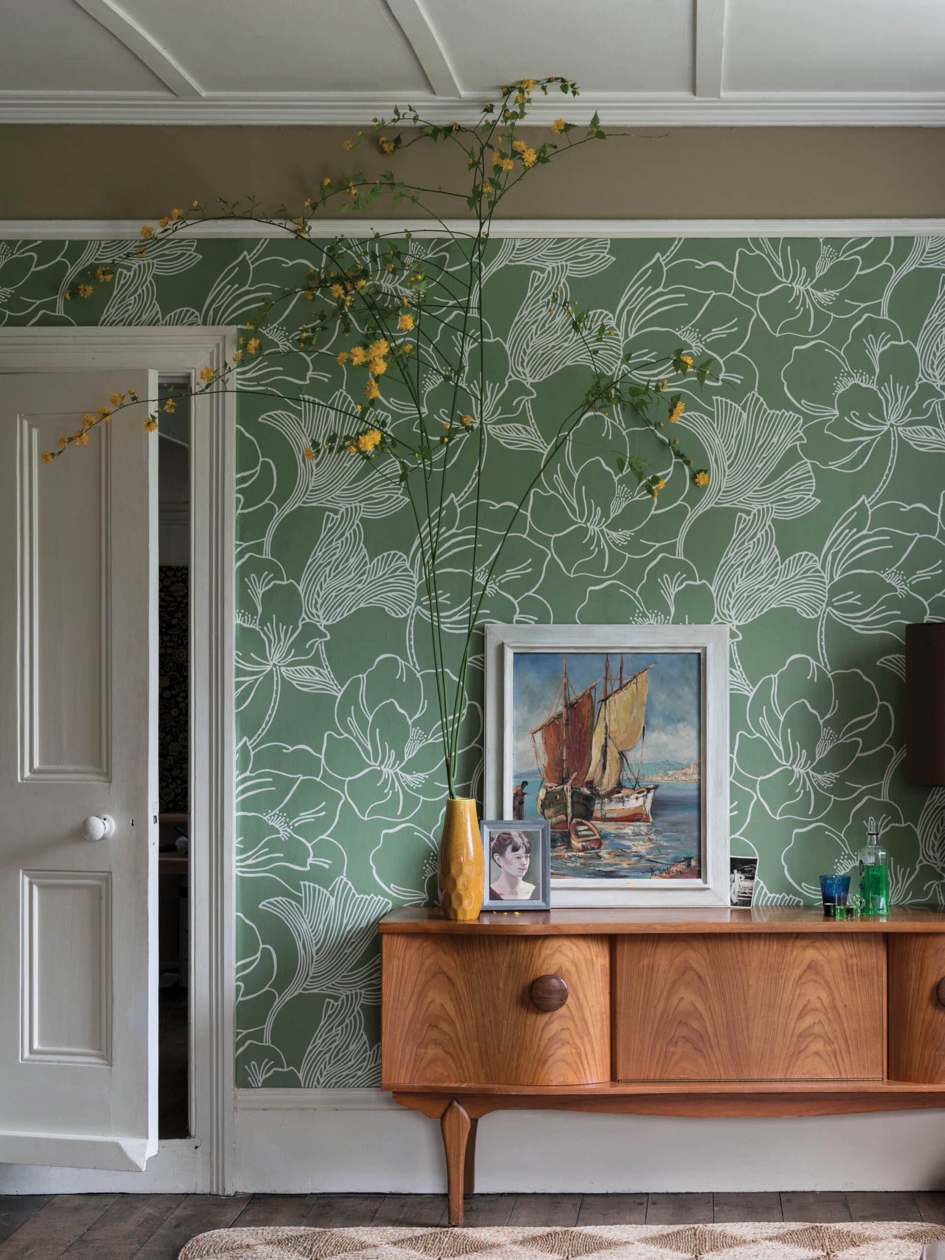 green wallpapered living room